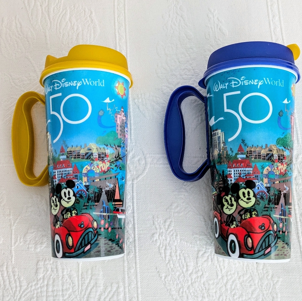 Two Disney World 50th Anniversary Drinking Cups with covers